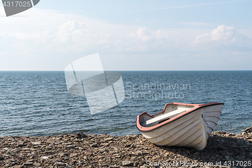 Image of Small rowing boat by the coast