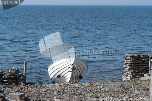 Image of Landed white row boat