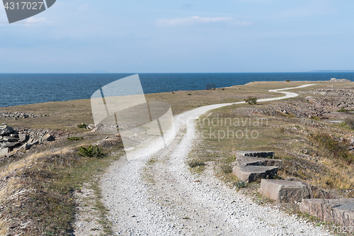 Image of Winding gravel road in a coastal landscape