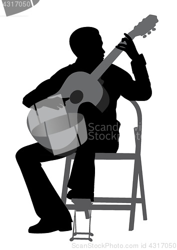 Image of Young man playing acoustic guitar
