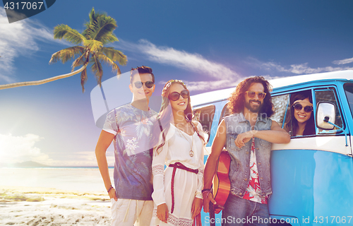 Image of happy hippie friends at minivan car on beach