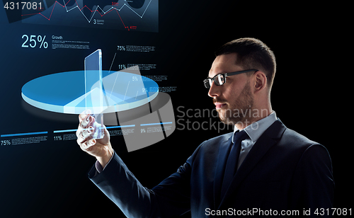 Image of businessman with tablet pc and virtual charts