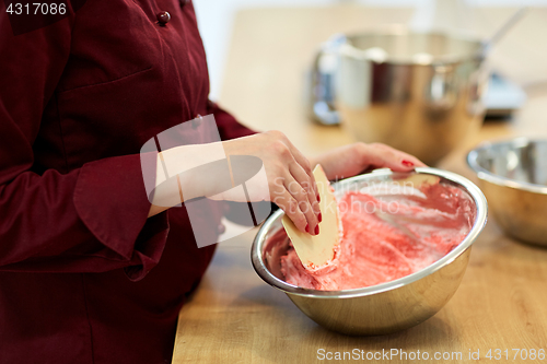 Image of chef making macaron batter at confectionery