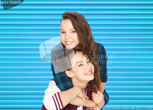 Image of happy smiling pretty teenage girls hugging