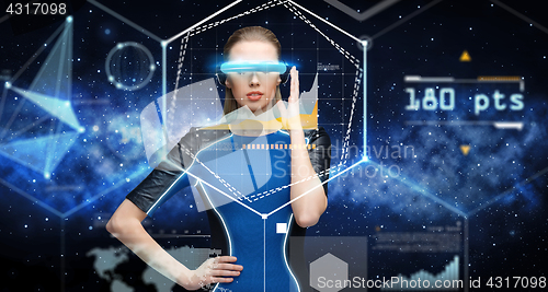 Image of woman in virtual reality 3d glasses with charts