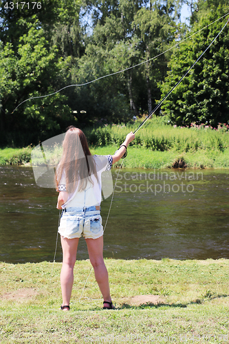 Image of Young while fishing