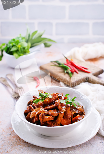 Image of fried mushrooms with vegetables