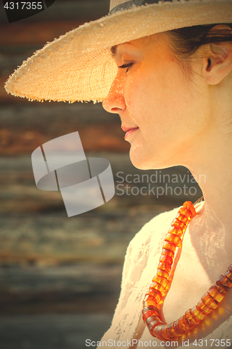 Image of woman with an amber necklace