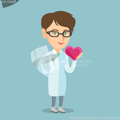 Image of Young caucasian doctor cardiologist holding heart.