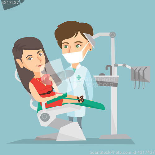 Image of Patient and doctor in the office of a dentist.