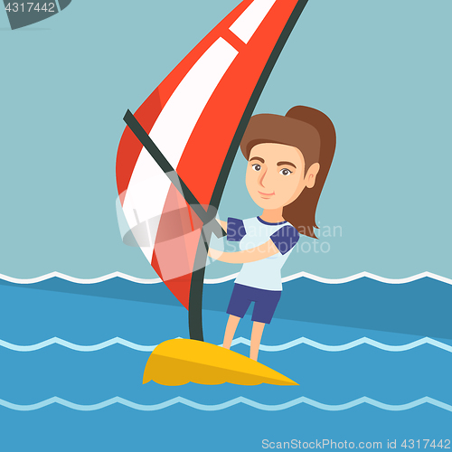 Image of Young caucasian woman windsurfing in the sea.