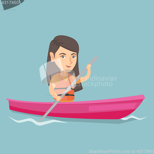 Image of Young caucasian woman travelling by kayak.