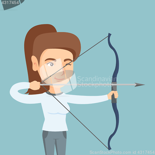 Image of Young caucasian archer training with a bow.