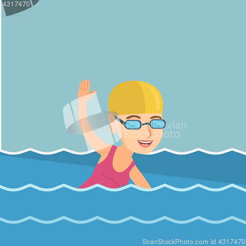 Image of Young caucasian sportswoman swimming.