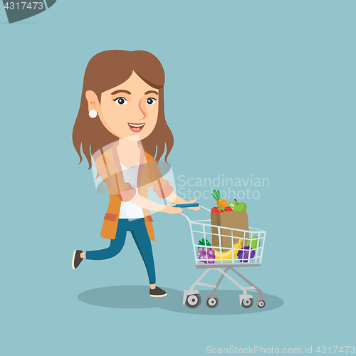 Image of Caucasian woman running with a shopping trolley.