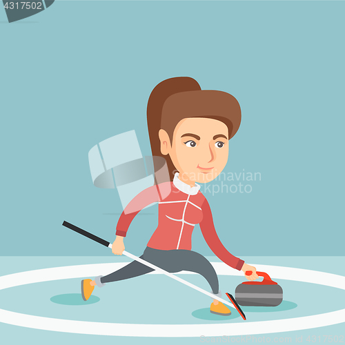 Image of Sportswoman playing curling on a skating rink.