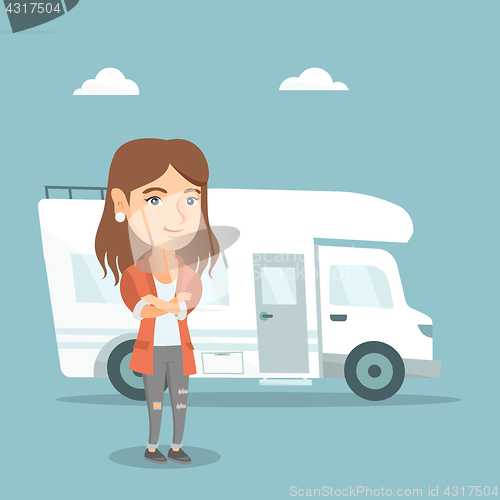 Image of Caucasian woman standing in front of motorhome.