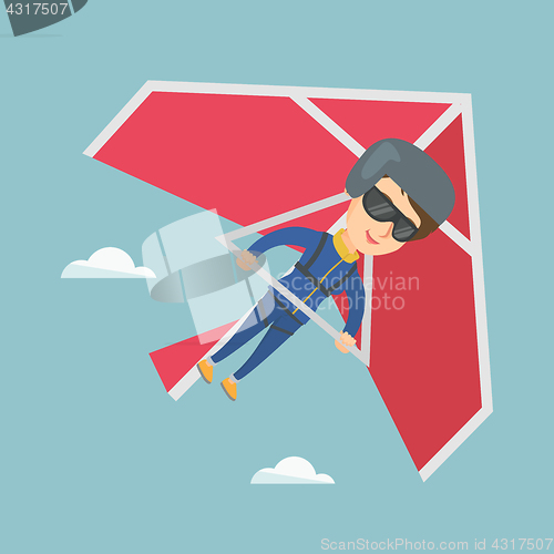 Image of Young caucasian woman flying on hang-glider.