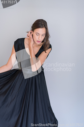 Image of woman in a black dress isolated on white background