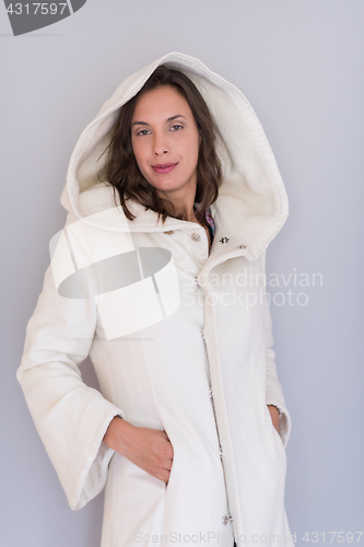 Image of woman in a white coat with hood isolated on white background