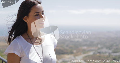 Image of Young brunette enjoying sunlight