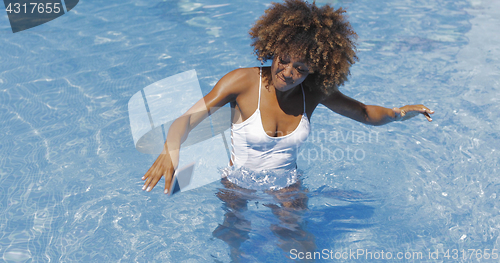 Image of Woman dropping phone in pool