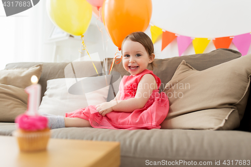 Image of happy baby girl on birthday party at home