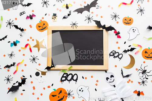 Image of blank chalkboard and halloween party decorations