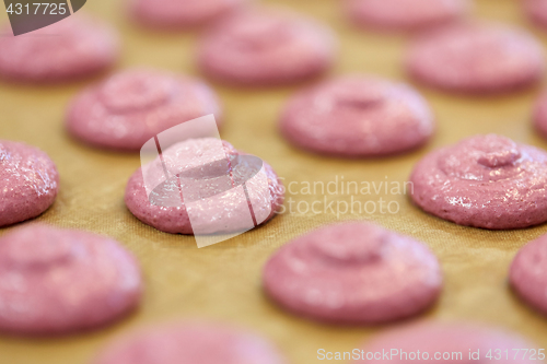 Image of macaron batter or meringue cream on baking paper