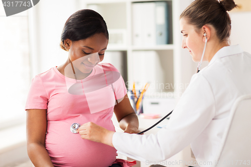 Image of gynecologist doctor and pregnant woman at hospital