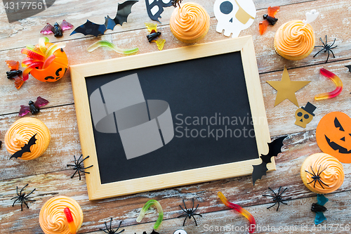 Image of blank chalkboard and halloween party decorations