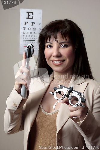 Image of Eye doctor with equipment