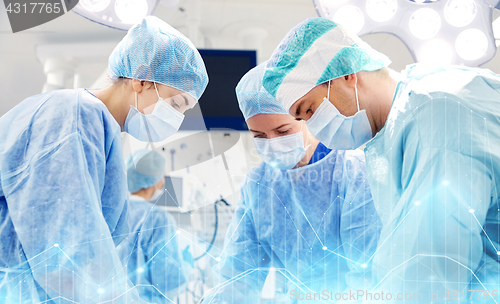 Image of group of surgeons in operating room at hospital