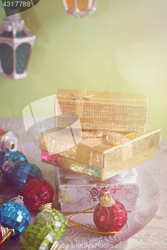 Image of Christmas toys, lights and golden presents, retro toned