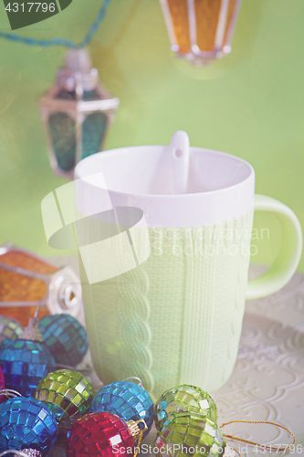 Image of Cup and christmas toys, retro toned