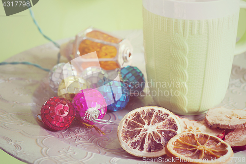 Image of Cup and cuted fruits, retro toned