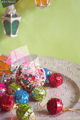 Image of Christmas lights and balls, retro toned