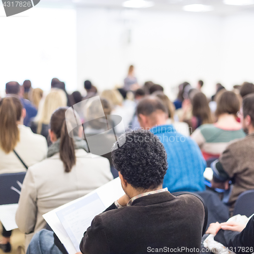 Image of Woman giving presentation on business conference.