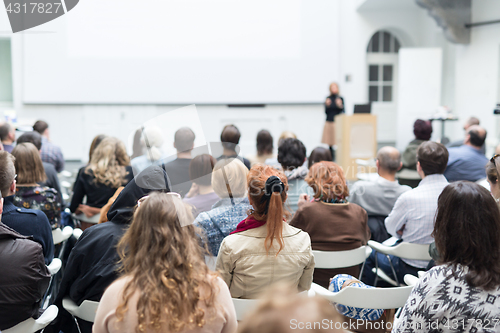 Image of Woman giving presentation on business conference.