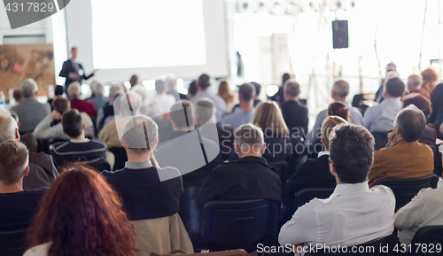 Image of Business speaker giving a talk at business conference event.