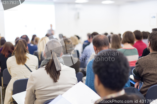 Image of Woman giving presentation on business conference.