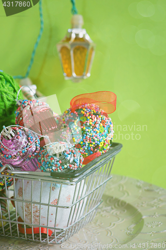 Image of Christmas balls in shopping basket, retro toned