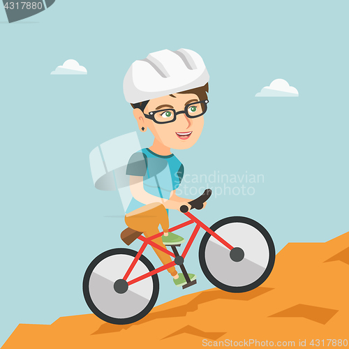 Image of Young woman on bicycle traveling in the mountains.