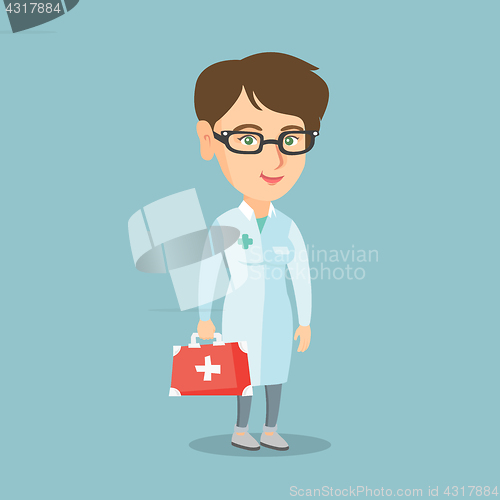 Image of Young caucasian doctor holding a first aid box.