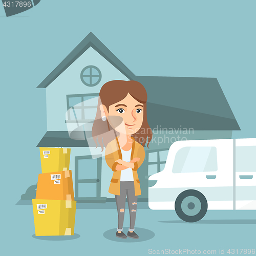 Image of Young caucasian woman moving to a new house.