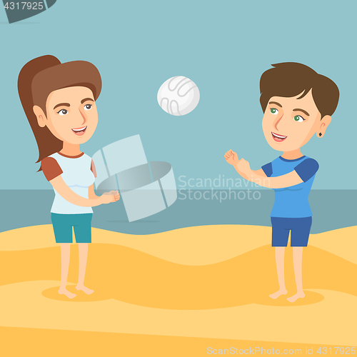 Image of Two caucasian women playing beach volleyball.