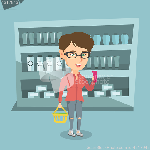 Image of Woman holding shopping basket and a tube of cream.