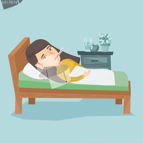Image of Sick woman with thermometer laying in bed.