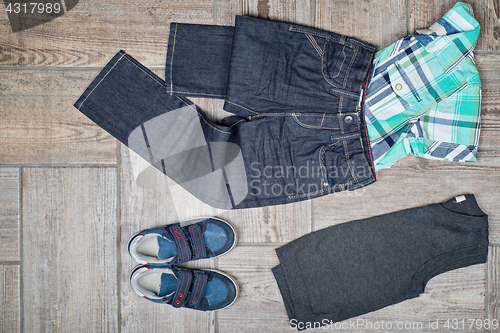 Image of Flat lay picture of boy\'s casual outfit.