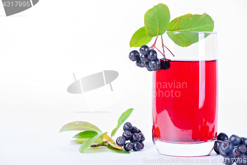 Image of Glass of aronia juice with berries